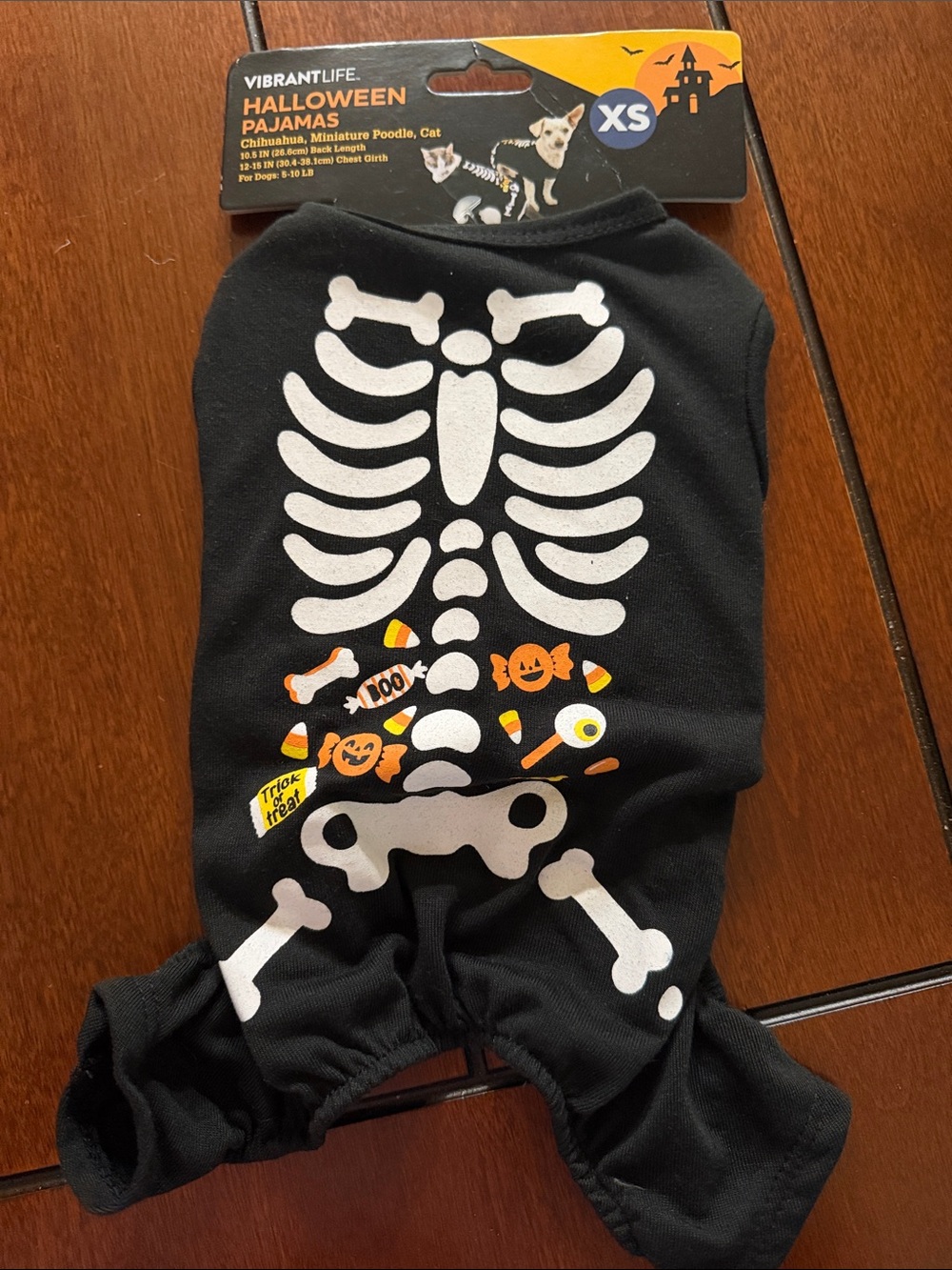 Vibrant Black Skeleton Dog Halloween Pajamas with Orange Candy Accents